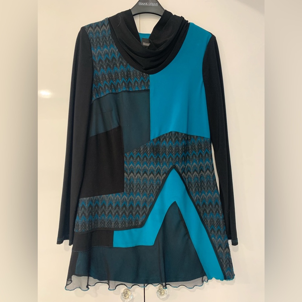 Color Block with sweater knit and sheer trim detail. Turquoise and black.